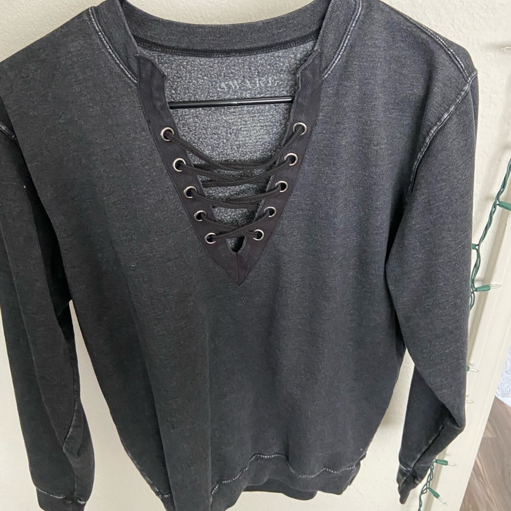 Distressed crisscross crew neck